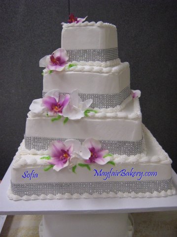 4 tier Sofia - 4 tier square with each tier turned slightly. Diamond glitter ribbon and flowers.4", 8", 12", 20" tiers.&amp;nbsp;